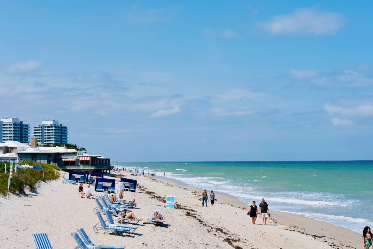 Beachgoers enjoying sunny day in Vero Beach, Florida